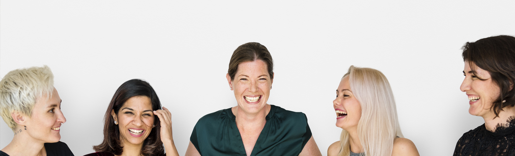five women laughing together